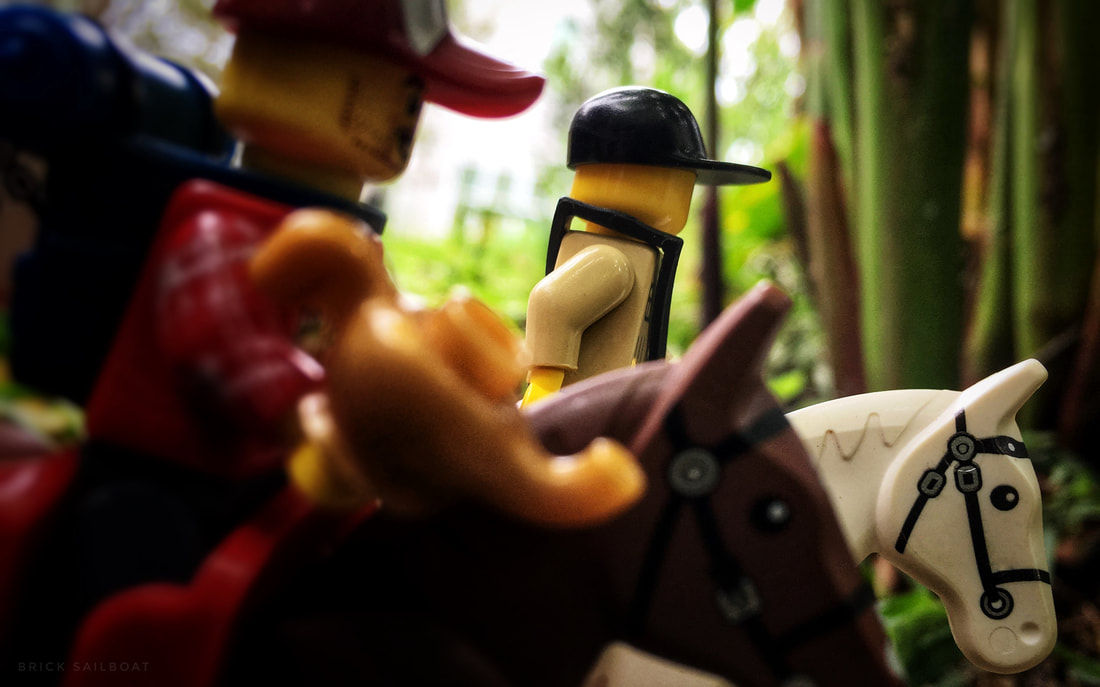 LEGO minifigures on horseback running away with the magic lamp