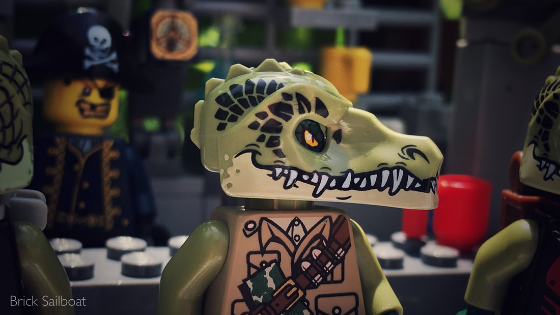 A LEGO Chima gator sitting down at the swamp bar
