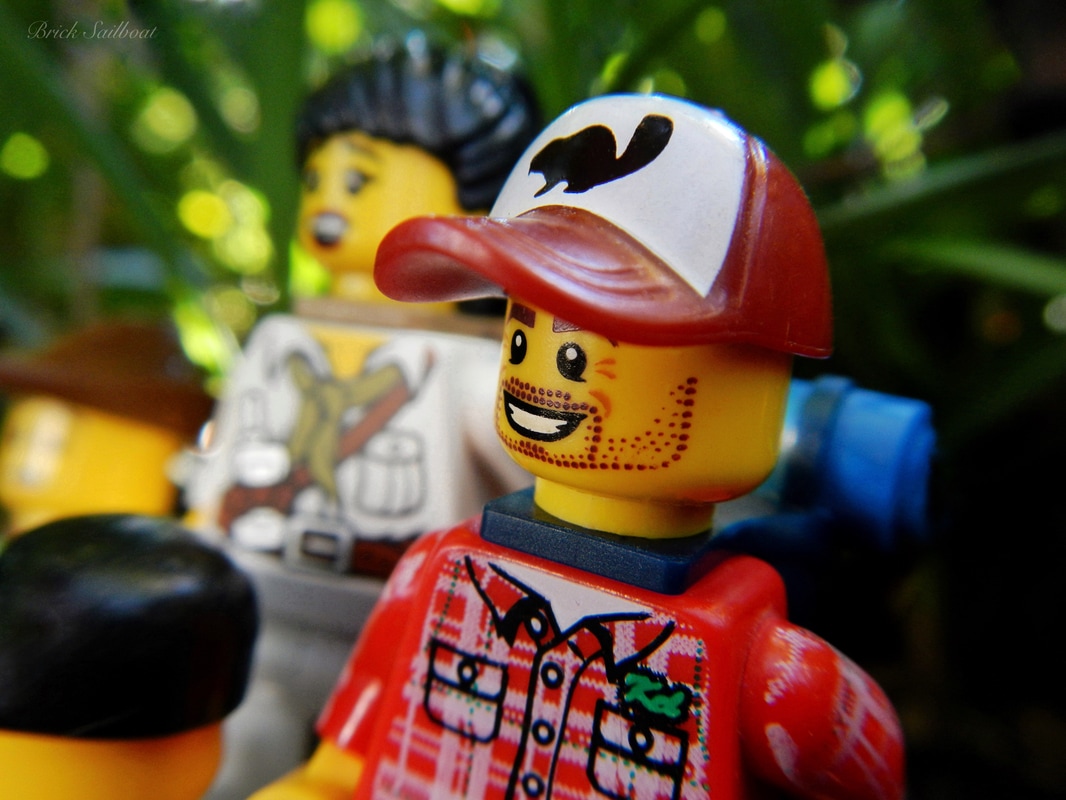 A group of LEGO minifigures hiking in the forest