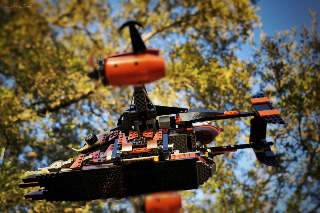 LEGO airship flying into the forest